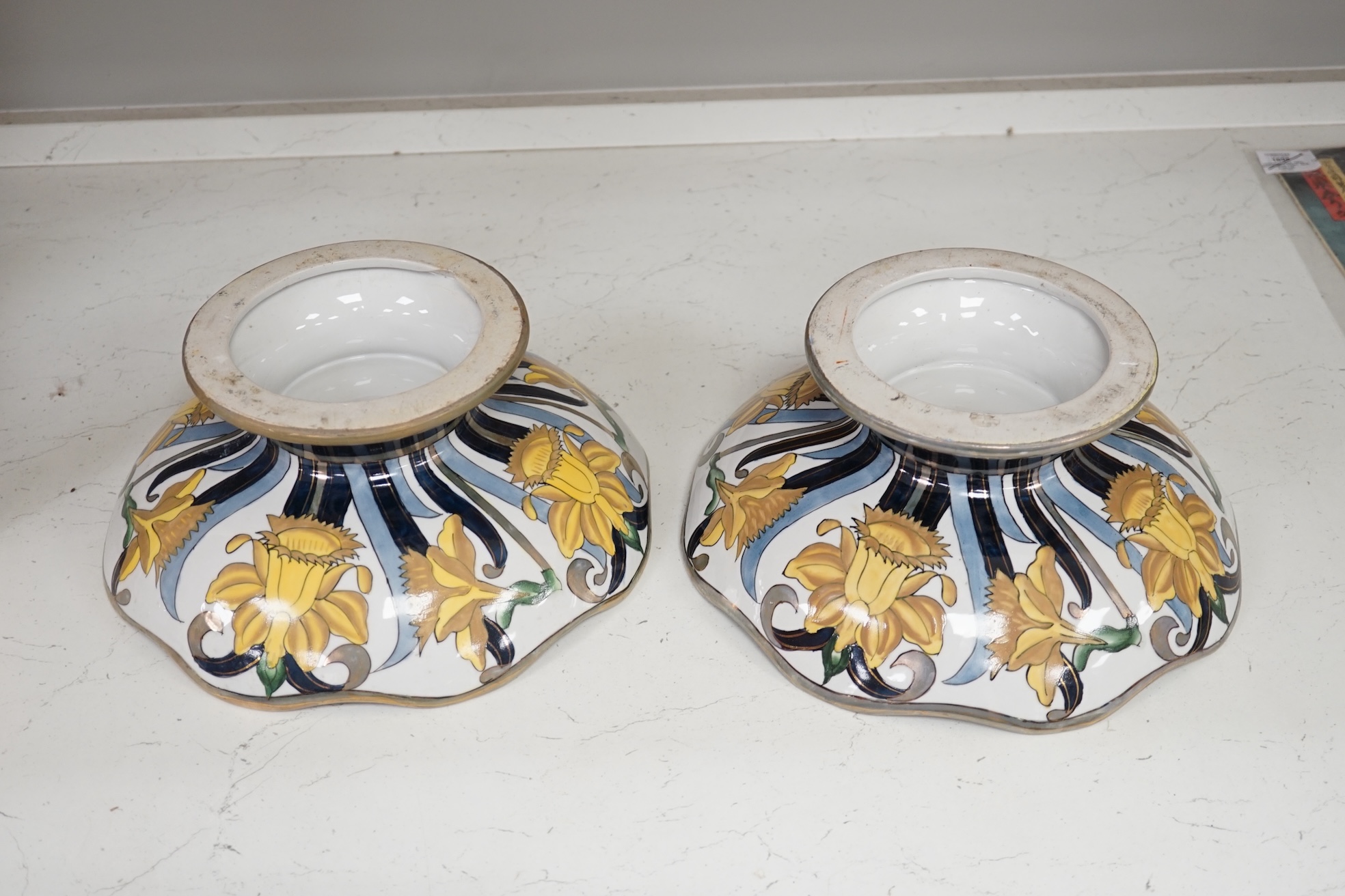 A pair of Fieravino pedestal daffodil dishes, 31cm diameter. Condition fair, one with notable surface wear.